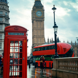 A street in London featuring Big Ben, a red telephone box, and a double-decker bus