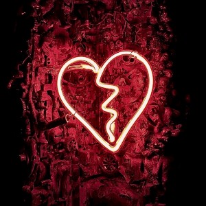 Red neon sign of a broken heart
