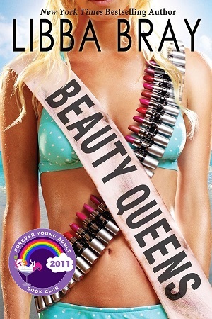 A white girl in a bikini wears a beauty pageant sash on one shoulder and a bandolier of lipsticks on the other