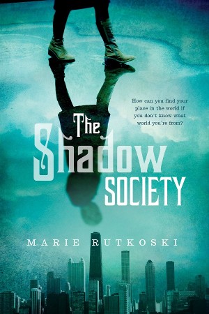 Cover of The Shadow Society, with the reflection of a girl walking on a wet street and the Chicago skyline at the bottom