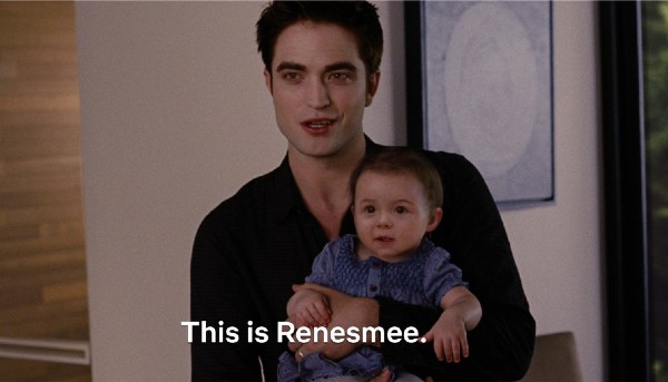 Edward holding baby Renesmee, who has a weird CGI face