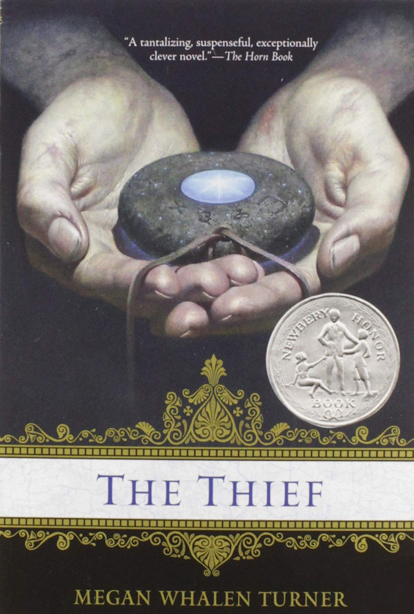 Cover The Thief: Hands holding a disc on a string