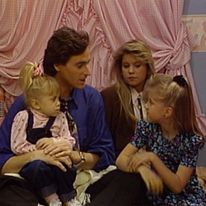Michelle, Danny, DJ, and Stephanie Tanner having a heart to heart in a child's bedroom
