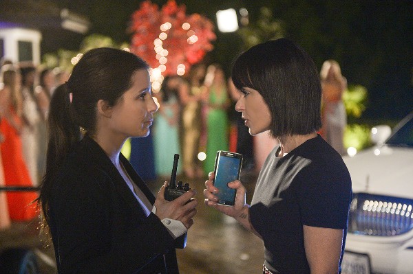 Rachel, a white brunette woman, talking to Quinn, a white woman with a bob