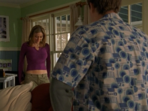 Pacey's wearing a loud patterned blue-and-white shirt, while Gretchen's wearing a cute, snug purple top