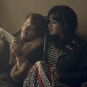 Katy Perry and Diego Luna snuggling in one of her music videos