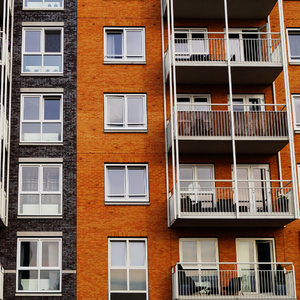 A brick apartment building with balconies