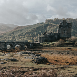 A beautiful old castle nestled into rolling hills in Scotland