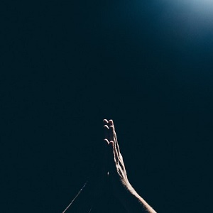 Hands pressed together in prayer