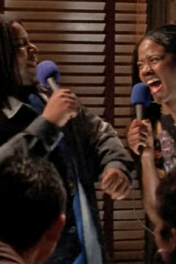 DeForrest and Elena singing karaoke together