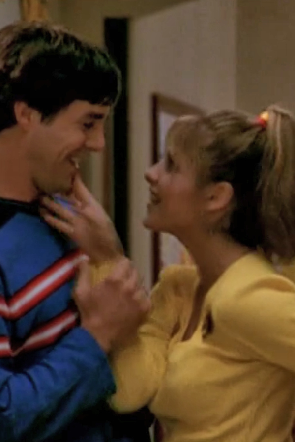 Buffy touches Xander's face while under a spell