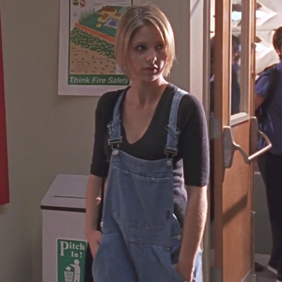Buffy looking sad in overalls