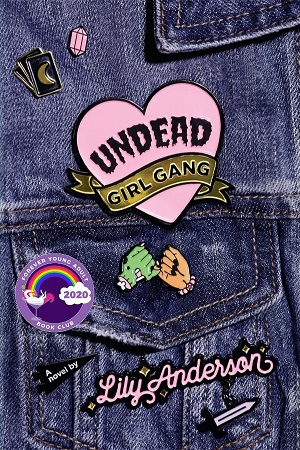 Cover Undead Girl Gang: Denim jacket pocket with enamel pins of a zombie and human hand pinky swearing