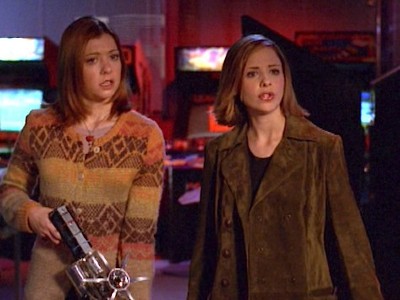 Willow holds a ray gun while assisting Buffy
