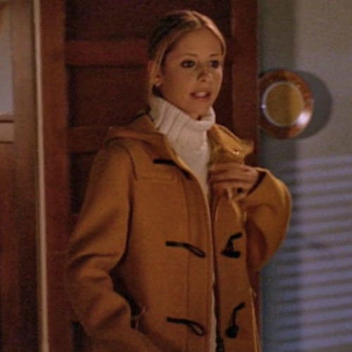 Buffy wearing a fisherman's sweater and a cute yellow coat.