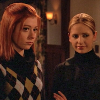 Willow shows her support to Buffy by giving Riley's wife a mean look.