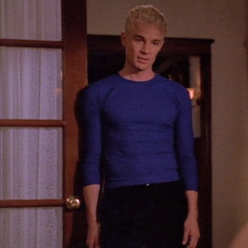 Spike wearing a super tight bright blue shirt with three-quarter sleeves.