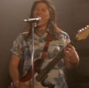 Kim Deal of The Breeders playing guitar and singing on The Bronze stage