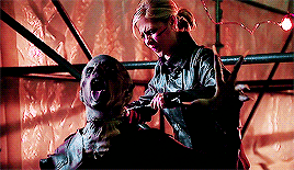 Buffy beheading the Turok-Han, a big nasty vampire