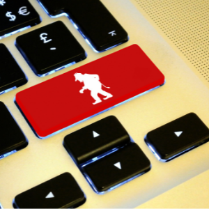 Red shift key on a computer keyboard with outline of a troll