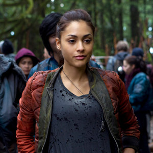 Close up of Ravon Reyes from The 100 wearing a red jacket