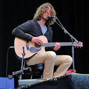 Chris Cornell performing with a guitar onstage