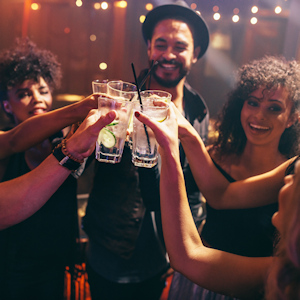 Group of friends having drinks at the night club party