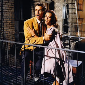 Maria and Tony from West Side Story singing on a balcony.