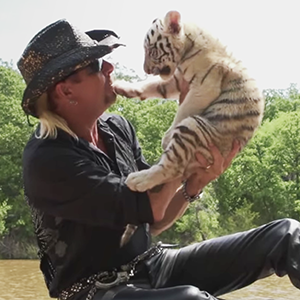 Netflix Tiger King Joe Exotic and tiger cub.