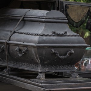 An ornate black coffin
