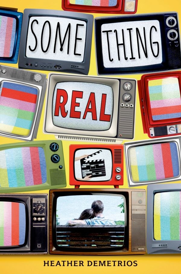 Cover of Something Real: yellow background, illustration of different TVs stacked on top of each other, with bottom centre TV showing the backs of a couple sitting on a park bench