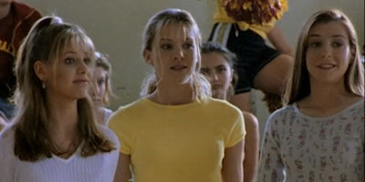 Buffy, Amy, and Willow standing in the gym