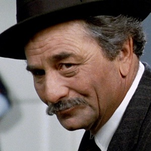 Peter Falk from The Princess Bride with a mischievous twinkle in his eye 