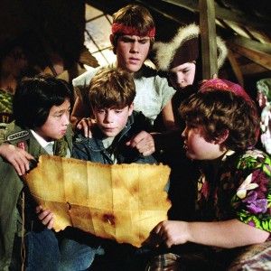 Characters from Goonies studying a treasure map