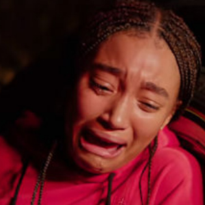 Starr crying seeing her best friend shot in the movie version of The Hate U Give