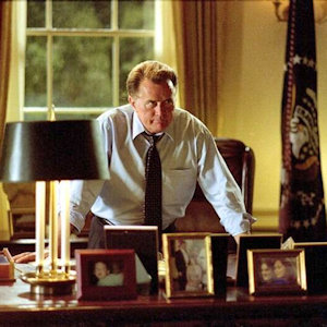 President Barrett from West Wing standing behind his desk