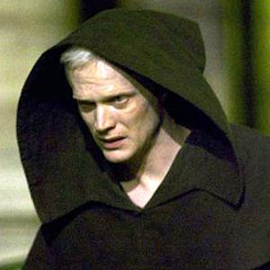Paul Bettany as an albino man in a hooded robe depicting a religious zealot from the movie Angels and Demons