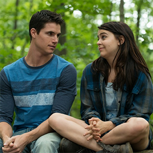 Wesley and Bianca from The Duff sitting on a Rock