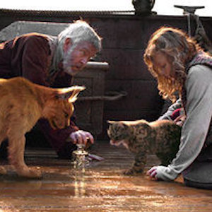 An old man and a young girl look at something on the ground with their animal daemons