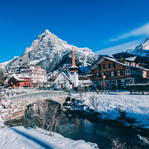 Snow covered mountains and a chalet in Switzerland