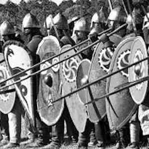A group of soldiers carrying spears and shields