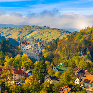 Rolling hills of Romania in autumn covered with colorful trees