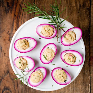 Deviled eggs with the edges are bright pink