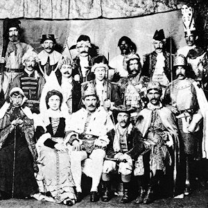 B&W image of a group of mummers dressed up in their costumes