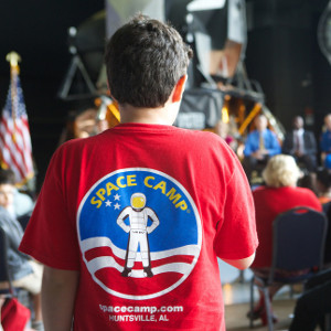 The back of a kid's shirt that says "Space Camp"