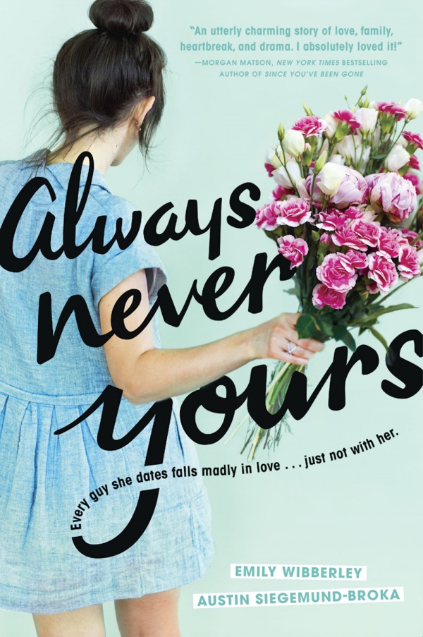 Girl with hair in bun and blue dress holding bouquet of roses