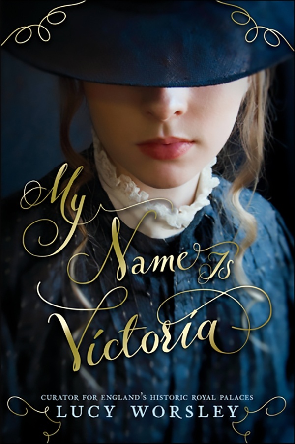 Close up of the face of a girl in Victorian clothing with her had pulled down over her eyes