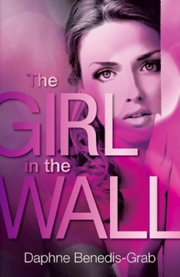 Cover of The Girl In The Wall: pink background with a close up of a girl's face