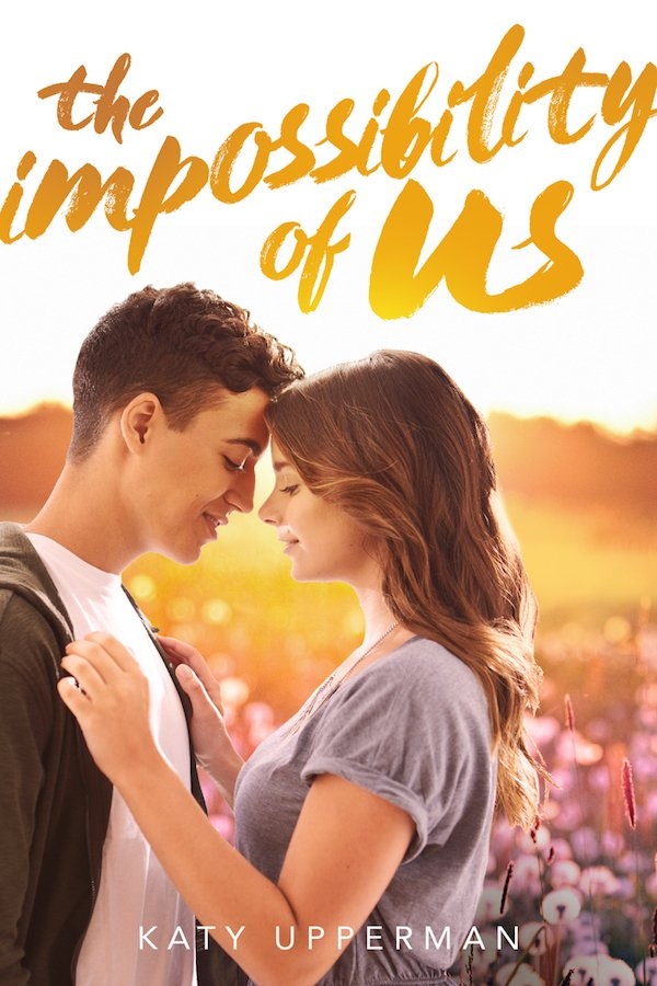 Cover The Impossibility of Us: A guy and girl embrace in a golden field of flowers