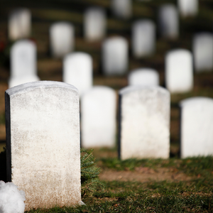 White tombstones in a row and stretching on in the background